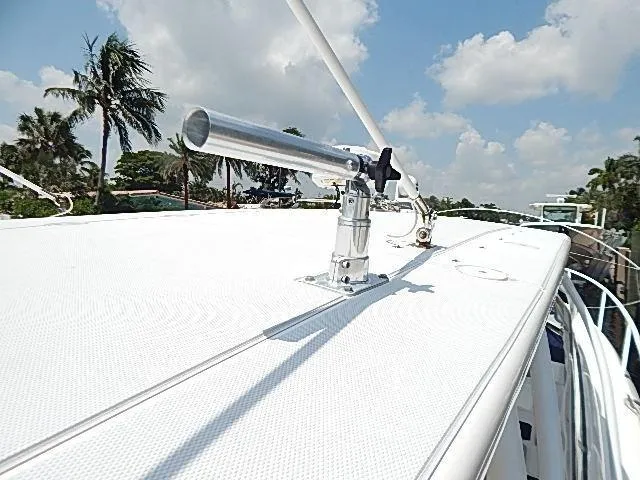 Intrepidation Yacht Photos Pics 2009 Intrepid 430 Sport Yacht deck with rod holder, palm trees, and blue sky.