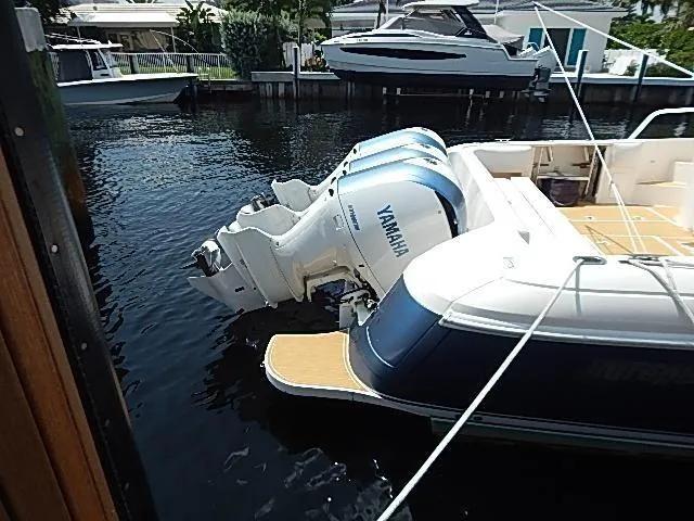 Intrepidation Yacht Photos Pics 2009 Intrepid 430 Sport Yacht with Yamaha outboard engines docked in a marina.