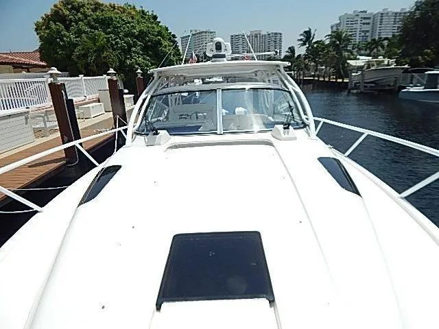 Intrepidation Yacht Photos Pics 2009 Intrepid 430 Sport Yacht docked, showcasing sleek design and spacious deck.