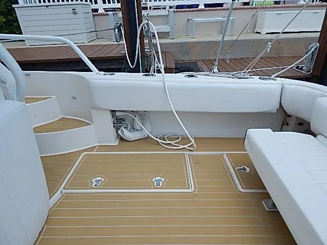 Intrepidation Yacht Photos Pics 2009 Intrepid 430 Sport Yacht deck with white seating and teak flooring.