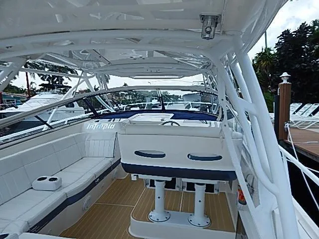 Intrepidation Yacht Photos Pics 2009 Intrepid 430 Sport Yacht interior with white seating and wooden flooring.