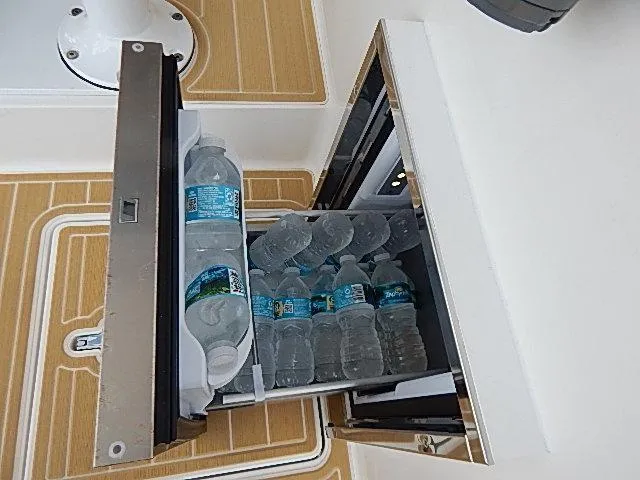 Intrepidation Yacht Photos Pics Built-in cooler with water bottles on 2009 Intrepid 430 Sport Yacht.