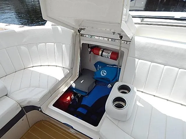 Intrepidation Yacht Photos Pics 2009 Intrepid 430 Sport Yacht storage compartment with fire extinguisher and life jackets.