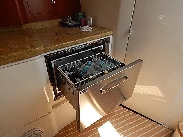 Intrepidation Yacht Photos Pics Drawer-style fridge on 2009 Intrepid 430 Sport Yacht, stocked with bottled water.