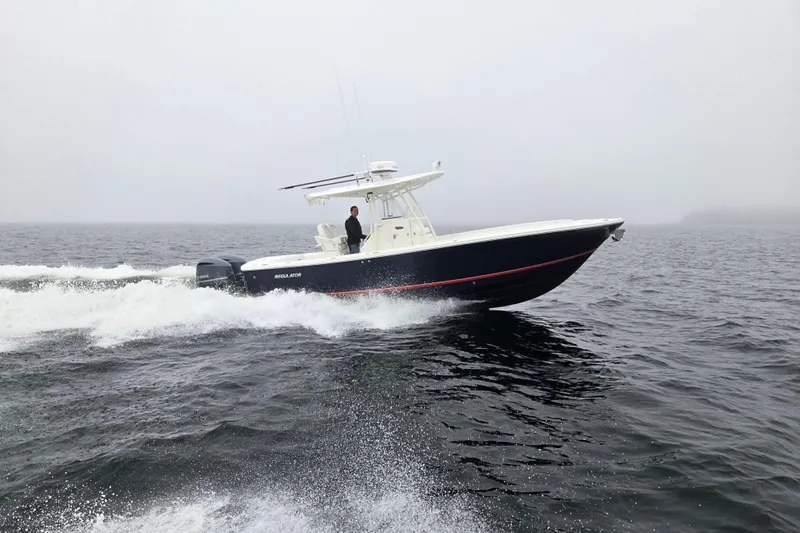  Yacht Photos Pics 2015 Regulator 28 Forward Seating boat cruising on open water.