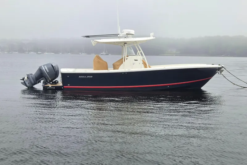  Yacht Photos Pics 2015 Regulator 28 Forward Seating boat on calm water, side view.