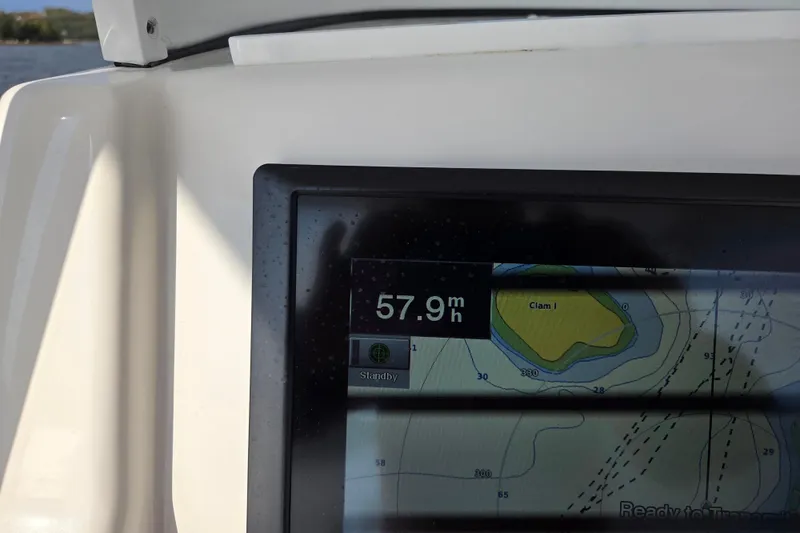  Yacht Photos Pics Dashboard of 2015 Regulator 28 Forward Seating showing speed at 57.9 mph.