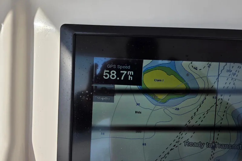  Yacht Photos Pics GPS display showing speed of 58.7 mph on 2015 Regulator 28 Forward Seating boat.