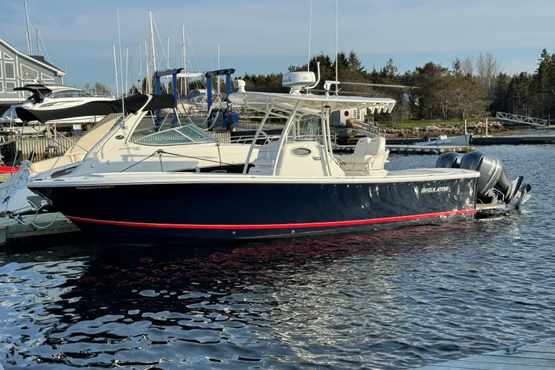  Yacht Photos Pics 2015 Regulator 28 Forward Seating boat docked in marina, featuring twin outboard engines.