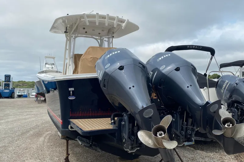  Yacht Photos Pics 2015 Regulator 28 Forward Seating boat with dual Yamaha 300 engines, docked outdoors.