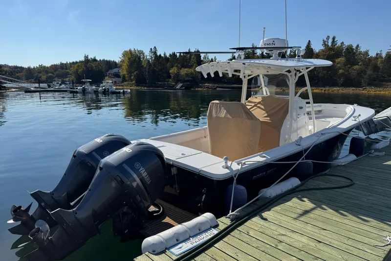  Yacht Photos Pics 2015 Regulator 28 Forward Seating boat docked with twin Yamaha engines.