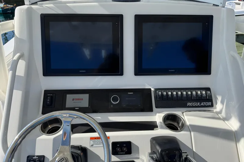  Yacht Photos Pics Control panel of a 2015 Regulator 28 Forward Seating boat with dual Garmin displays.