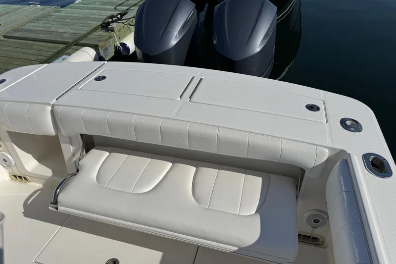  Yacht Photos Pics 2015 Regulator 28 Forward Seating boat with white cushioned seats and dual engines.