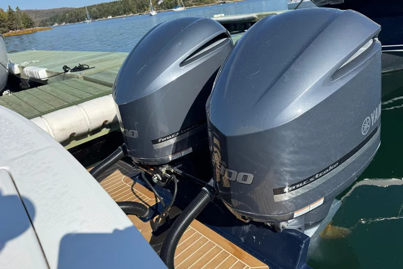  Yacht Photos Pics Twin Yamaha outboard engines on a 2015 Regulator 28 Forward Seating boat at a dock.
