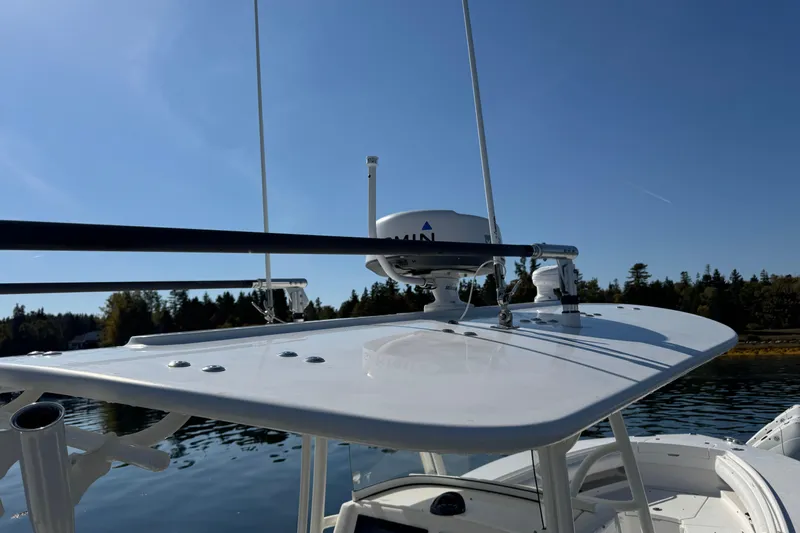  Yacht Photos Pics 2015 Regulator 28 Forward Seating boat with radar equipment against clear blue sky.