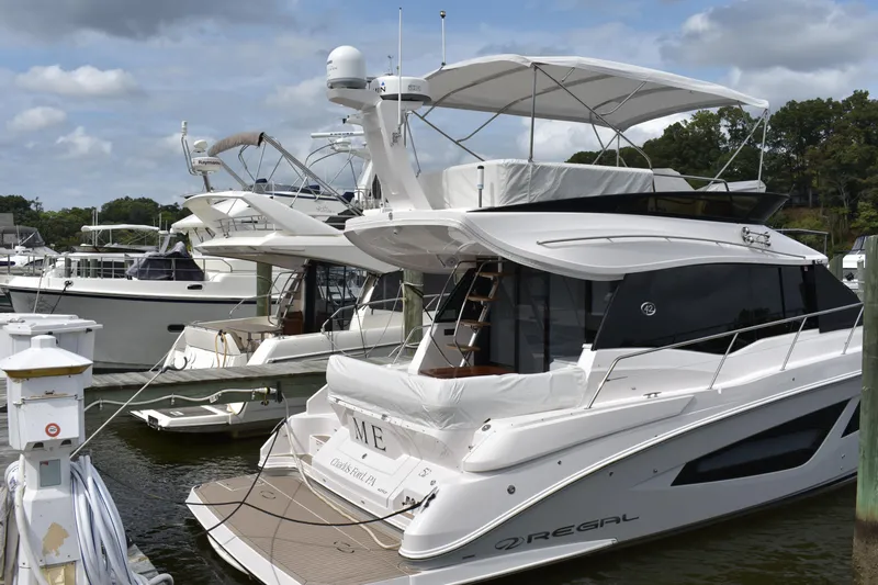 Me Yacht Photos Pics 2021 Regal 42 Fly yacht docked at marina, featuring sleek design and modern amenities.