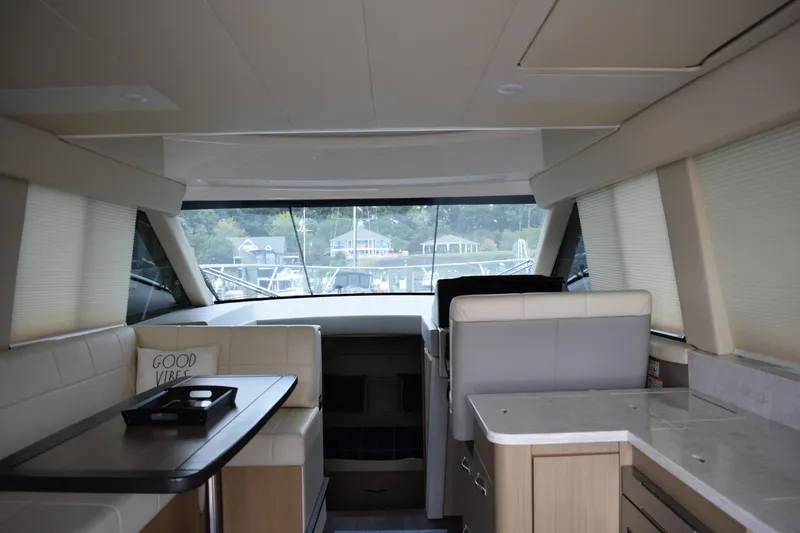 Me Yacht Photos Pics Interior of 2021 Regal 42 Fly yacht with modern seating and panoramic windows.