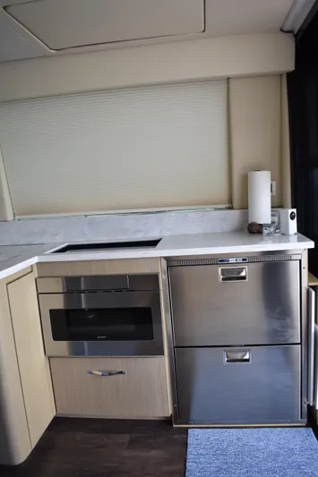 Me Yacht Photos Pics Modern kitchen area in 2021 Regal 42 Fly yacht with stainless steel appliances.