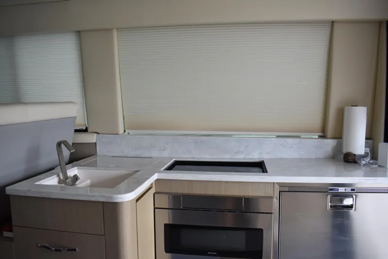 Me Yacht Photos Pics Modern kitchen interior of 2021 Regal 42 Fly yacht with sleek appliances.