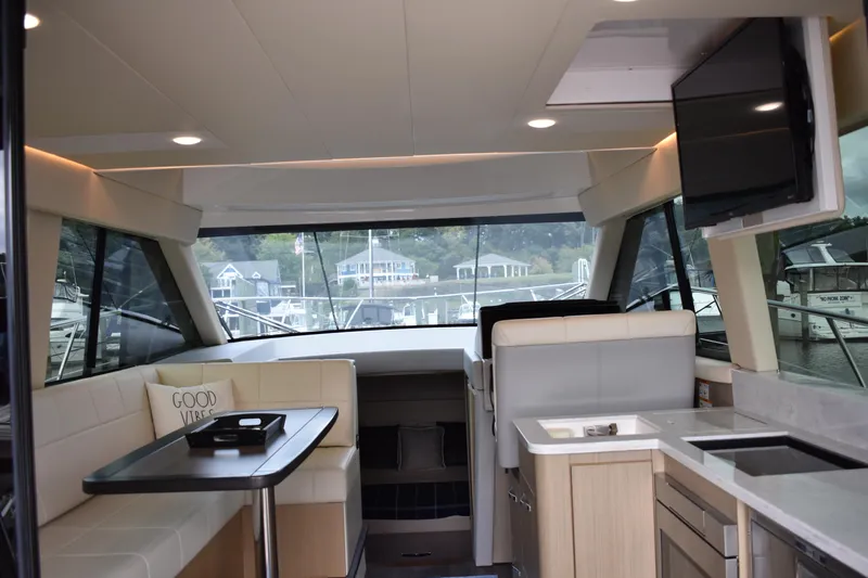 Me Yacht Photos Pics Luxurious interior of 2021 Regal 42 Fly yacht with modern amenities and scenic view.