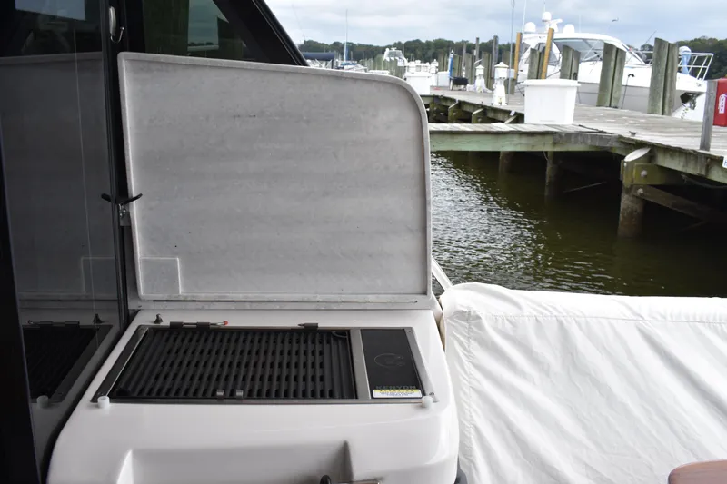 Me Yacht Photos Pics Regal 42 Fly 2021 yacht grill area by the dock.