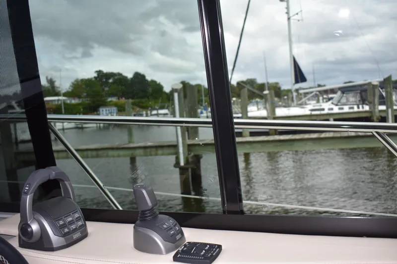 Me Yacht Photos Pics View from 2021 Regal 42 Fly yacht window overlooking marina with communication devices.