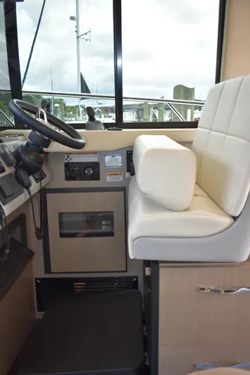 Me Yacht Photos Pics 2021 Regal 42 Fly helm station with modern controls and comfortable seating.