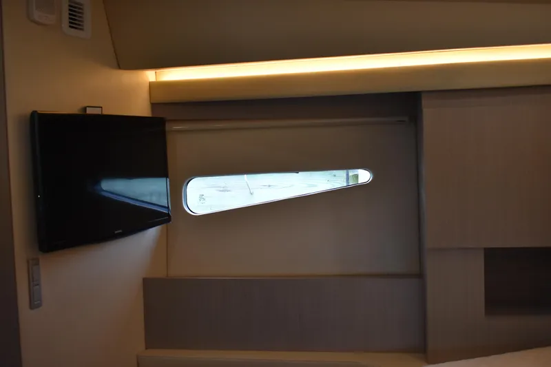 Me Yacht Photos Pics Interior of 2021 Regal 42 Fly yacht with TV and window.
