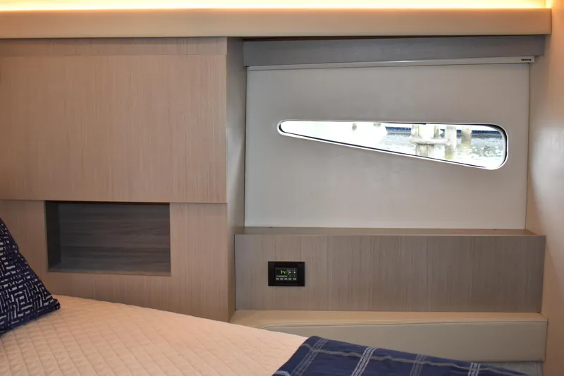 Me Yacht Photos Pics Interior cabin of 2021 Regal 42 Fly yacht with modern design and window view.