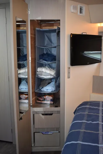 Me Yacht Photos Pics Interior of 2021 Regal 42 Fly yacht with closet and TV.