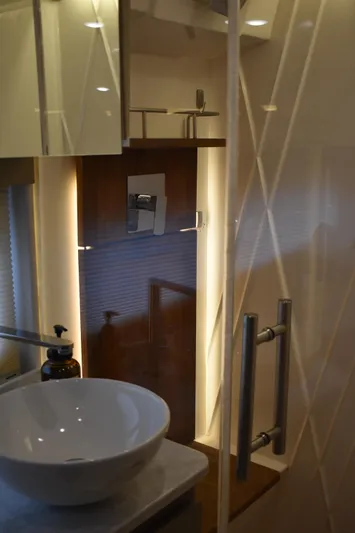 Me Yacht Photos Pics Luxurious bathroom interior of 2021 Regal 42 Fly yacht with modern fixtures.