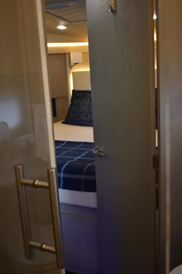 Me Yacht Photos Pics Interior cabin view of 2021 Regal 42 Fly yacht with cozy bedding.