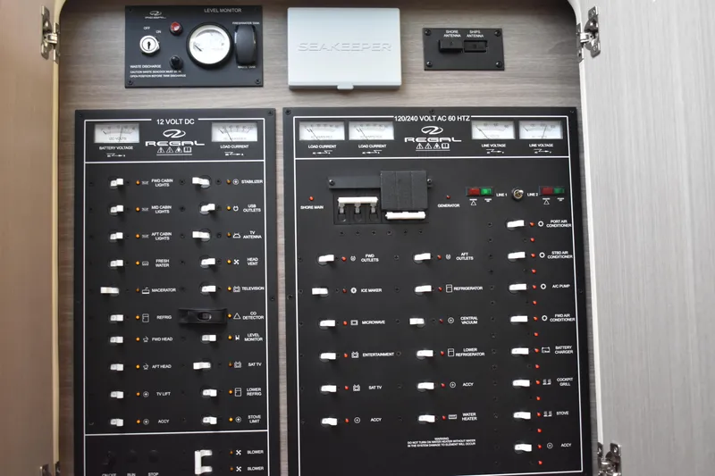 Me Yacht Photos Pics Electrical control panel of 2021 Regal 42 Fly yacht, featuring various switches and gauges.