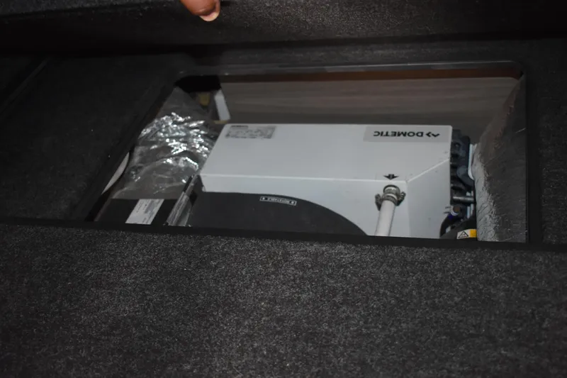 Me Yacht Photos Pics Hidden compartment in 2021 Regal 42 Fly boat, revealing Dometic equipment.