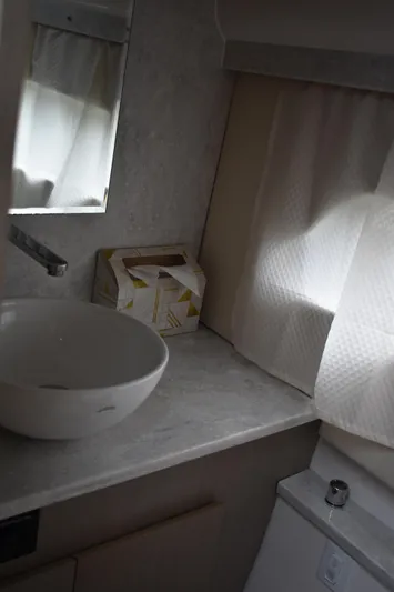 Me Yacht Photos Pics Modern bathroom interior of 2021 Regal 42 Fly yacht with sink and mirror.