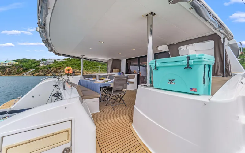 Wonderlust Yacht Photos Pics Luxurious 2016 Fountaine Pajot 72 yacht deck with seating and scenic ocean view.
