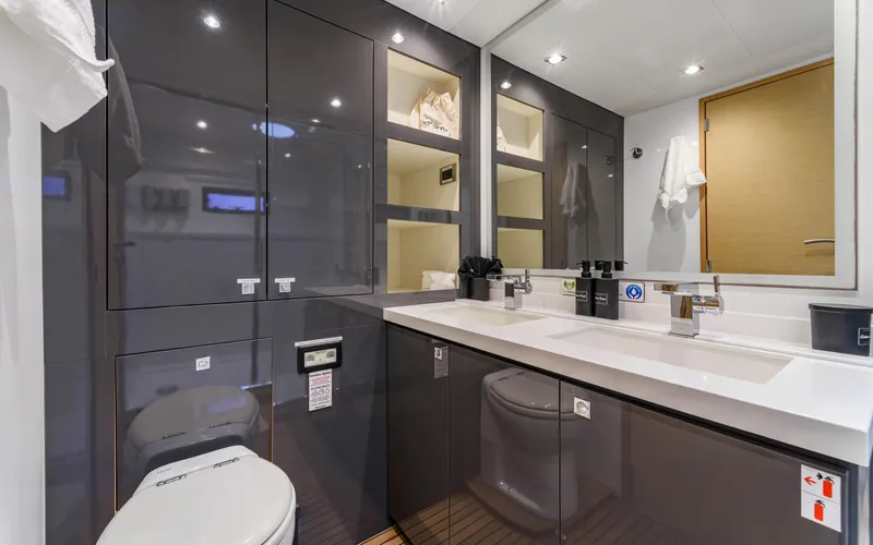 Wonderlust Yacht Photos Pics Luxurious bathroom in 2016 Fountaine Pajot 72 yacht with modern fixtures and sleek cabinetry.