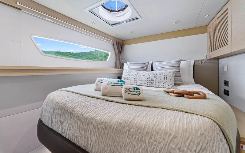 Wonderlust Yacht Photos Pics Luxurious cabin interior of 2016 Fountaine Pajot 72 yacht with scenic window view.