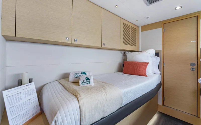 Wonderlust Yacht Photos Pics Luxurious cabin interior of 2016 Fountaine Pajot 72 yacht with single bed and modern decor.