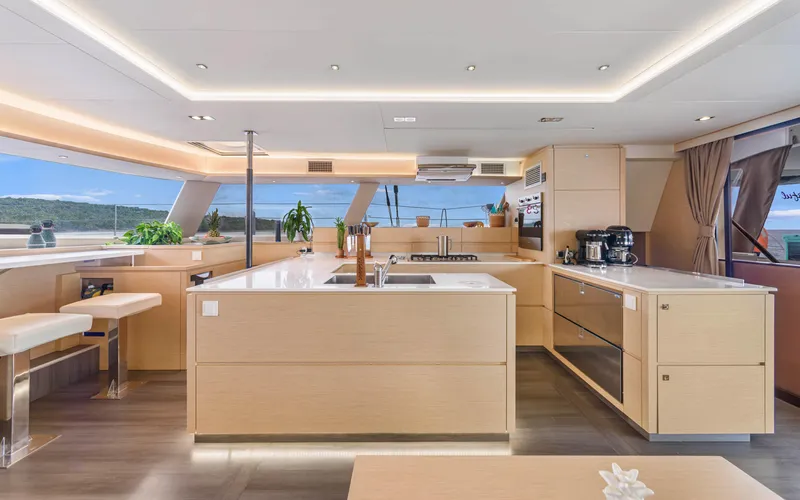 Wonderlust Yacht Photos Pics Luxurious interior of 2016 Fountaine Pajot 72 yacht with modern kitchen design.