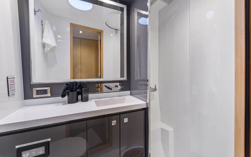 Wonderlust Yacht Photos Pics Luxurious bathroom in 2016 Fountaine Pajot 72 yacht, featuring modern fixtures and sleek design.