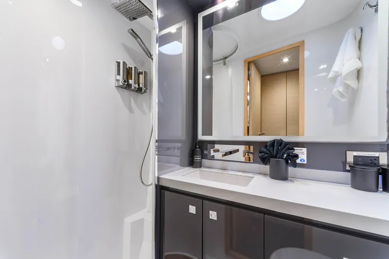 Wonderlust Yacht Photos Pics Luxurious bathroom in 2016 Fountaine Pajot 72 yacht, featuring modern fixtures and sleek design.