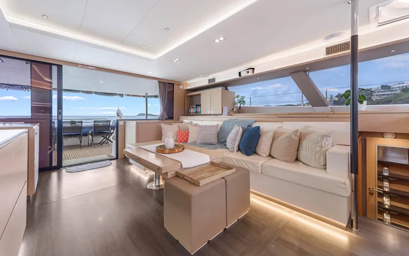 Wonderlust Yacht Photos Pics Luxurious interior of 2016 Fountaine Pajot 72 yacht with elegant seating and ocean view.