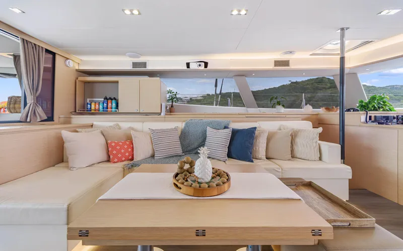 Wonderlust Yacht Photos Pics Luxurious interior of 2016 Fountaine Pajot 72 yacht with elegant seating and decor.