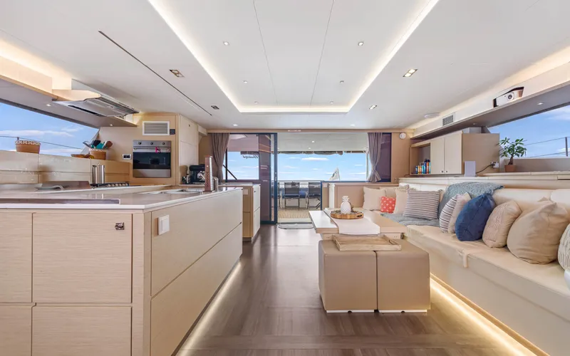 Wonderlust Yacht Photos Pics Luxurious interior of 2016 Fountaine Pajot 72 yacht with modern kitchen and seating area.