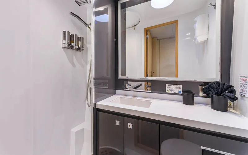 Wonderlust Yacht Photos Pics Modern bathroom interior on 2016 Fountaine Pajot 72 yacht, featuring sleek design and amenities.