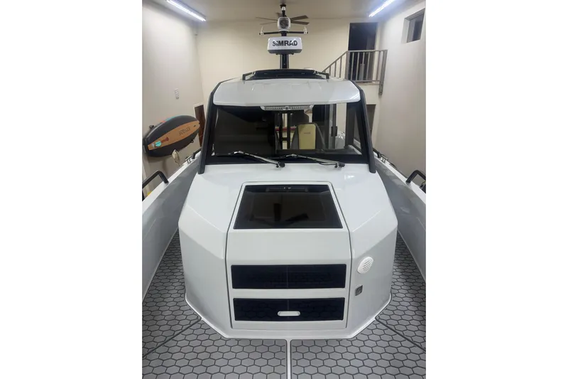 Dfndr1 Yacht Photos Pics 2021 XO Boats DFNDR 9 in a garage, showcasing its sleek, modern design.