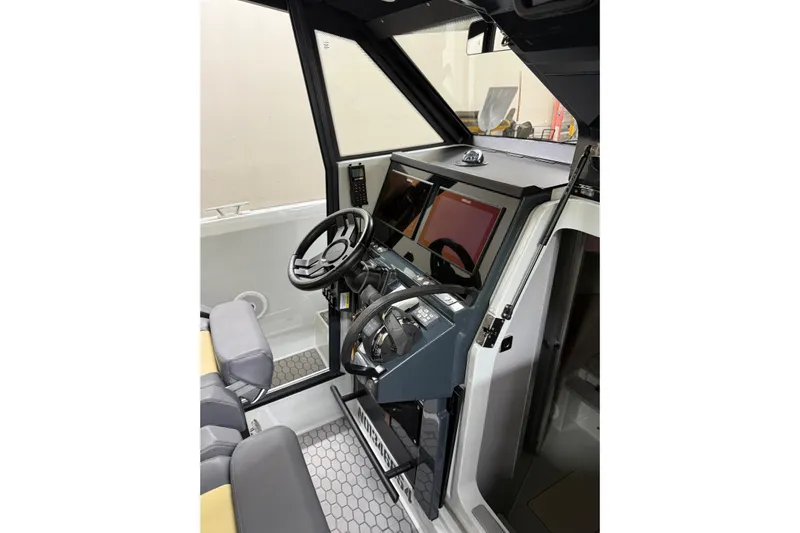 Dfndr1 Yacht Photos Pics 2021 XO Boats DFNDR 9 cockpit with modern steering and navigation controls.