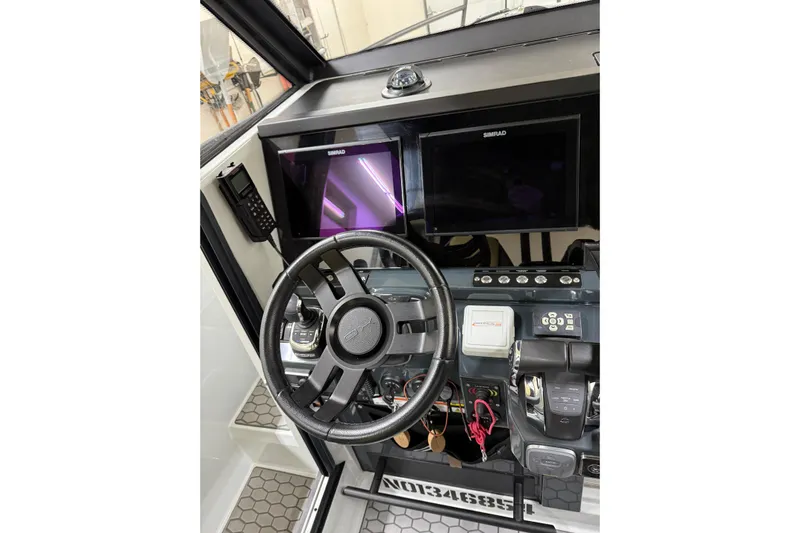 Dfndr1 Yacht Photos Pics Steering wheel and dashboard of 2021 XO Boats DFNDR 9 with Simrad displays.