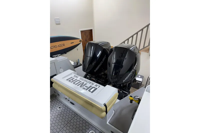 Dfndr1 Yacht Photos Pics 2021 XO Boats DFNDR 9 with dual Mercury outboard engines in a showroom.